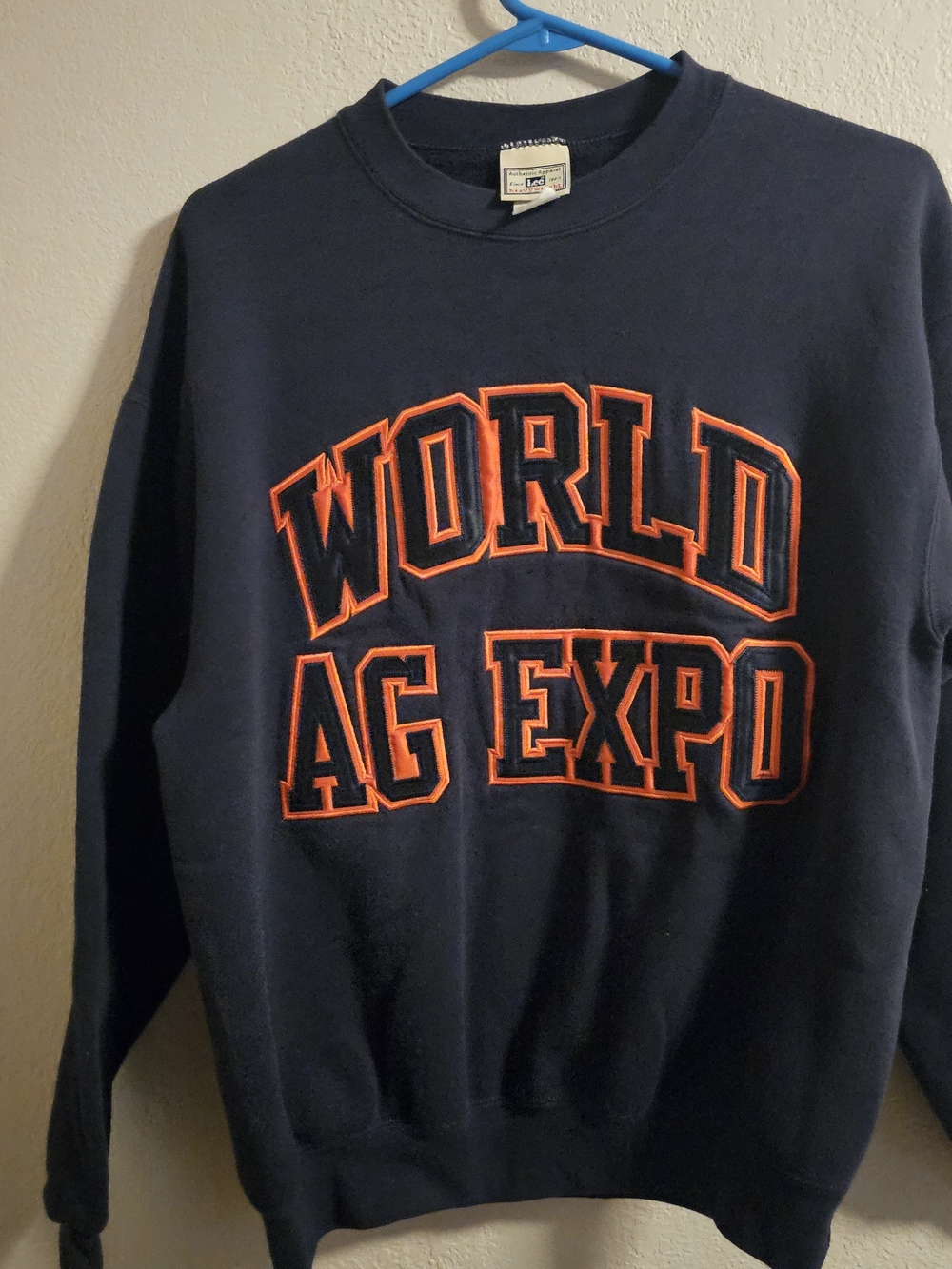 Vintage 1990s Lee sweatshirt features embroidered "World Ag Expo